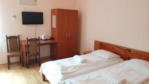 Łóżko lub łóżka w pokoju w obiekcie Hotel Haga