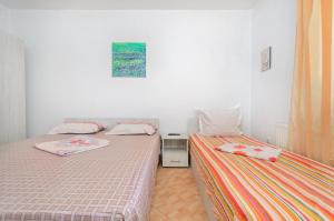 Postel nebo postele na pokoji v ubytování Vila Eliade