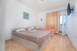 Postel nebo postele na pokoji v ubytování Vila Eliade
