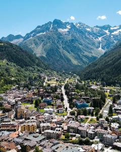 an aerial view of a town in the mountains at Grey Castle garnì&suite in Ponte di Legno
