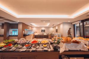 a buffet with many different types of food on a table at Kacha Resort & Spa, Koh Chang in Ko Chang