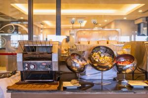a display of food and a toaster on a counter at Kacha Resort & Spa, Koh Chang in Ko Chang