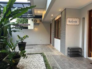 a hallway of a building with a sign that reads institute at Villa Magnifica by REQhome in Ciater-hilir