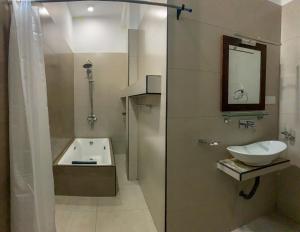 a bathroom with a sink and a bath tub at Cozy Resort Ella in Ella +37 photos