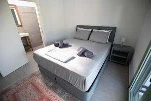Postel nebo postele na pokoji v ubytování Pine House