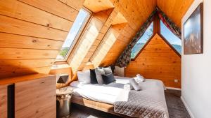 Posteľ alebo postele v izbe v ubytovaní Aparthotel Delta Zakopane
