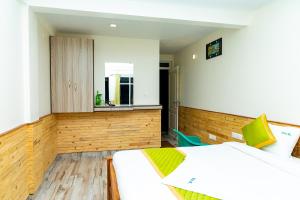 Rúm í herbergi á FabExpress RMK Nest - Nr Chettiar Park