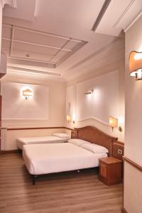 Postel nebo postele na pokoji v ubytování Hotel Hiberia