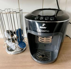 a black blender sitting on top of a counter at Nordsee Appartement in Hagen in Hagen