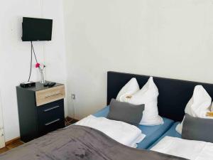 Nordsee Appartement in Hagen tesisinde bir odada yatak veya yataklar