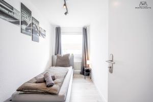 Ein Bett oder Betten in einem Zimmer der Unterkunft Monteursuite in Düren - bei Köln & Aachen