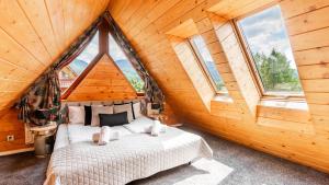 Posteľ alebo postele v izbe v ubytovaní Aparthotel Delta Zakopane