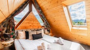 Posteľ alebo postele v izbe v ubytovaní Aparthotel Delta Zakopane