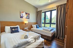 Postel nebo postele na pokoji v ubytování Onsen Premium Suites @ Tambun Ipoh