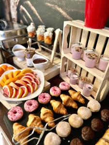 a table with a bunch of different types of pastries at Hotel Nosal Ski & Wine in Zakopane