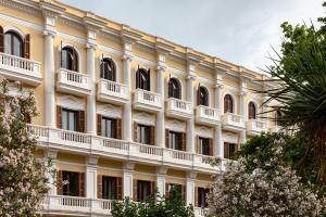 a large yellow building with a lot of windows at Montesol Experimental Ibiza in Ibiza Town