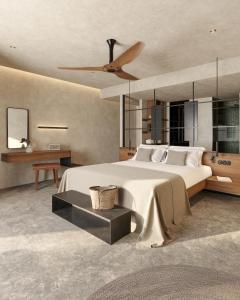 a bedroom with a large bed and a ceiling fan at King Jason Zante – Designed for Adults in Planos