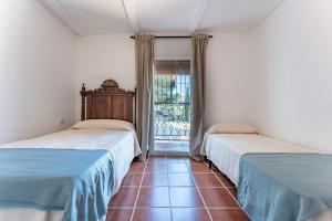 Posteľ alebo postele v izbe v ubytovaní Cortijo La Zahurdilla