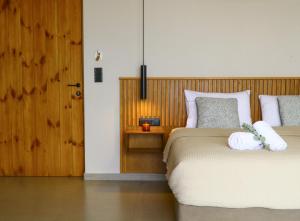 A bed or beds in a room at Petrichor