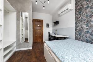 Postel nebo postele na pokoji v ubytování Quattro Loft Hostel