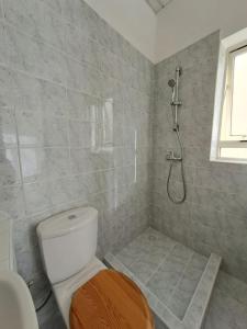 a bathroom with a toilet and a shower at No18 Cospicua in Cospicua