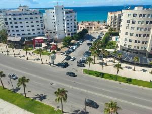 an aerial view of a city street with palm trees at Jardine Al Andalous in Tangier