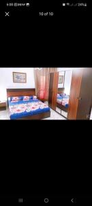 a picture of a bedroom with a bed and a mirror at شاليه بورتوسعيد in Port Said