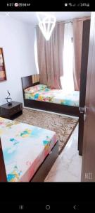 Posteľ alebo postele v izbe v ubytovaní شاليه بورتوسعيد