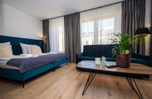 Posteľ alebo postele v izbe v ubytovaní InPoint Drive Inn - Stay&Park Free