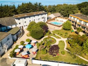 an aerial view of a resort with a pool at Hôtel de la Pointe de Mousterlin in Fouesnant