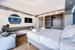 TV a/nebo společenská místnost v ubytování Island City Boutique Hotel