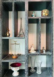 a shelf with vases and other items on it at Landhaus Apartment in Pettnau