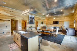 a kitchen and dining room with a table in a cabin at Burkesville Cabin, 3 Mi to Dale Hollow Lake! in Frogue