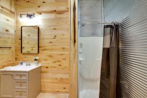 a bathroom with a shower and a sink at Burkesville Cabin, 3 Mi to Dale Hollow Lake! in Frogue
