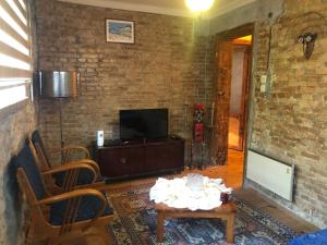 TV a/nebo společenská místnost v ubytování ozzy homes