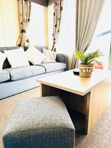 a living room with a coffee table and a couch at Cosy Corner in Filey