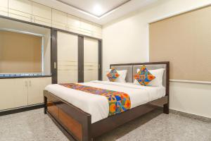 a bedroom with a bed in a room at Via RS Living - Nr TCS Deccan Park, Hitech City in Hyderabad