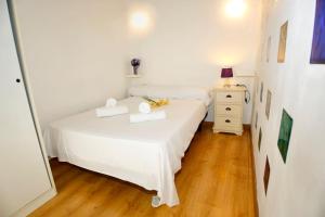 Ein Bett oder Betten in einem Zimmer der Unterkunft Ático en centro histórico Alcoy