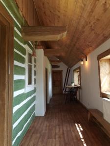 a hallway of a house with a wooden ceiling at Chata Šeřín in Vítkovice