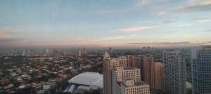 a view of a large city with tall buildings at RENTZONE88 in Manila