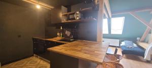 a kitchen with a wooden counter top in a room at Orbis in Prague