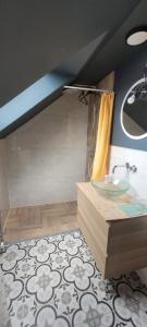 a bathroom with a sink and a counter with a shower at Orbis in Prague
