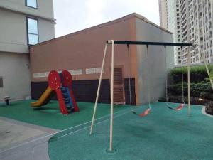 a playground with two swings and a slide at RENTZONE88 in Manila