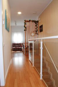 a hallway with a staircase in a house at Antich Apartment Deltebre in Deltebre