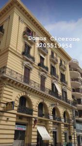 a building with a sign on the side of it at Domus Cicerone in Formia