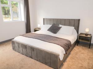 a bedroom with a large bed with two night stands at The Moores in Prestatyn