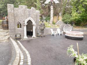 a statue of a man standing in front of a castle at The Moores in Prestatyn