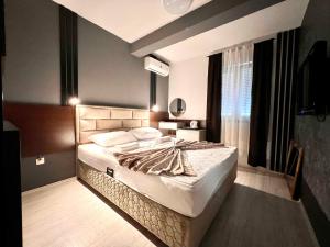 Postel nebo postele na pokoji v ubytování Hotel & Spa Villa Luxe