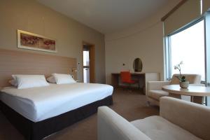 Postel nebo postele na pokoji v ubytování Orucoglu Oreko Hotel + 37 fotografií