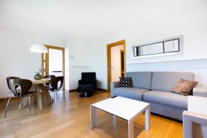 a living room with a couch and a table at Jaizkibel by Basquelidays in Hondarribia